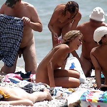 Unadorned girls sunbathes nude