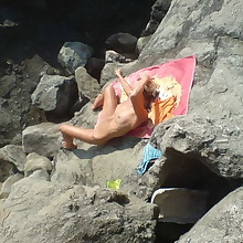 Unshod on beaches - Naturist woman on beach..