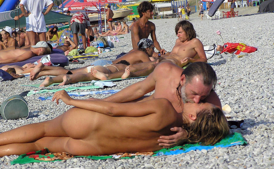 Nudist Photos Threesome on the rocky shore of a nudist beach.. Scene 4