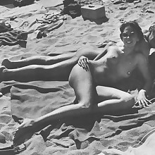  Retro charming naturist ladies's legs, tities, pussy, pubis, at beach presented.
