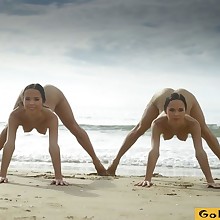 Naked gymnastics on the beach