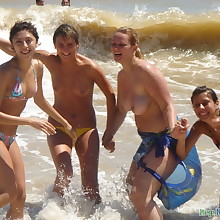 4 go-go girls at beach photos