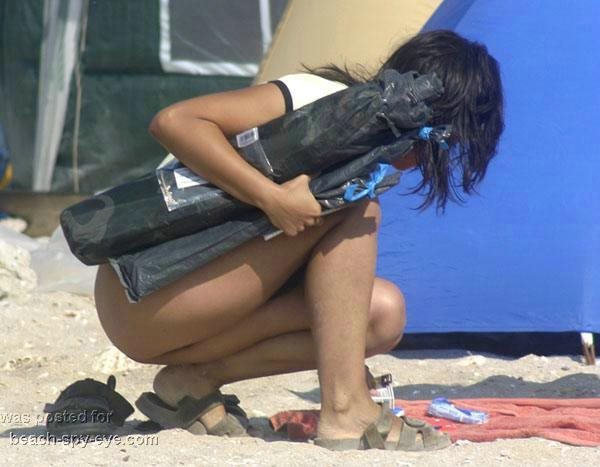 Bottomless on beaches A girl in a T-shirt but no panties underneath View 6