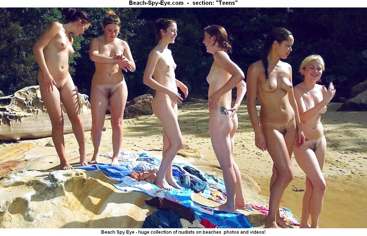 shining in the sun girls nudists relaxes without clothes at European beach
